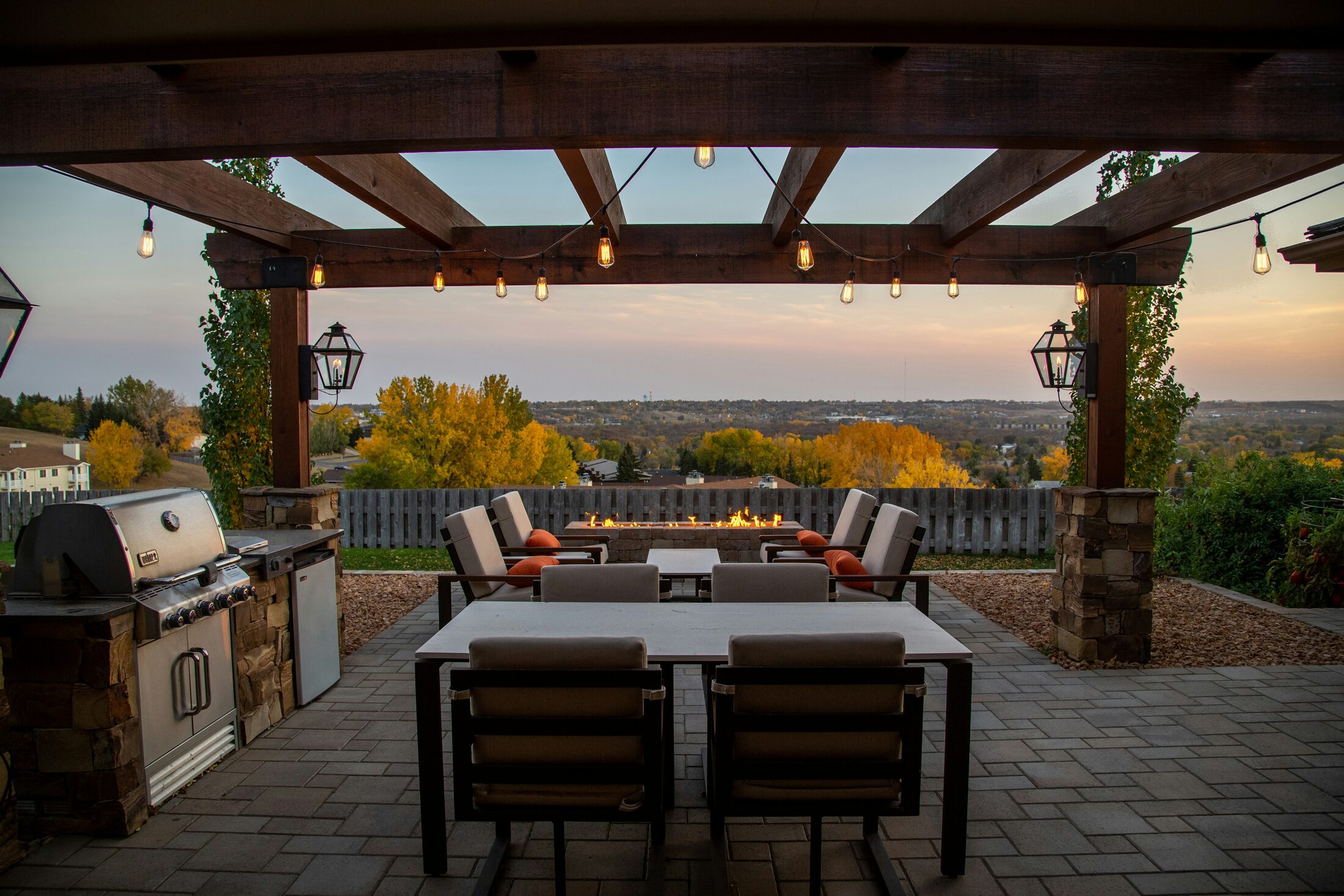 Outdoor dining terrace with paving and a pergola
